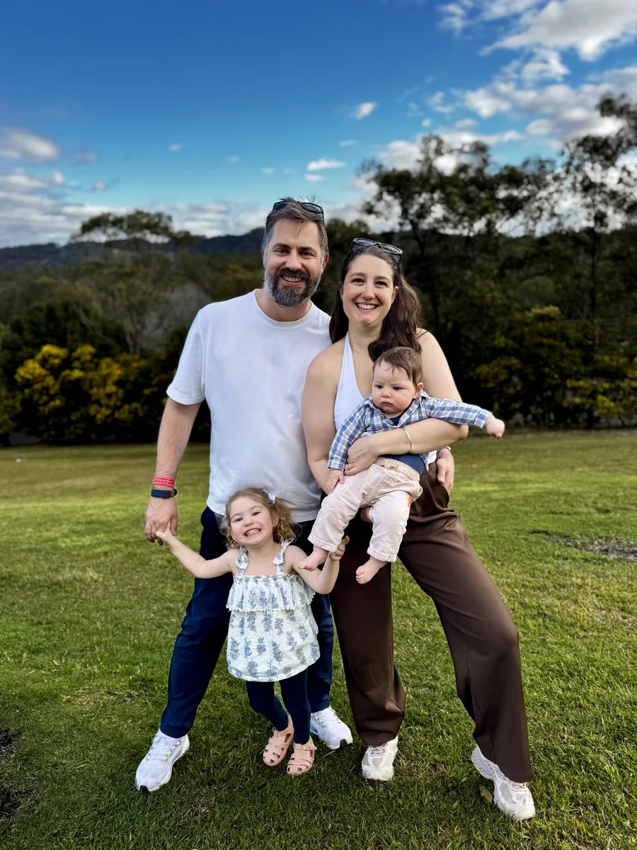 Andrew and his family outdoors