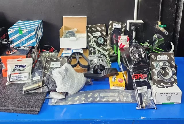 New engine parts laid out on the bench