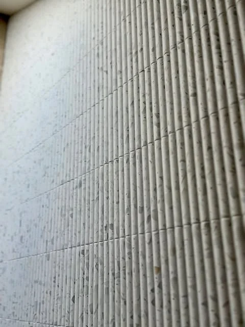 Close up of fluted wall tiles laid by Greyscale Tiling