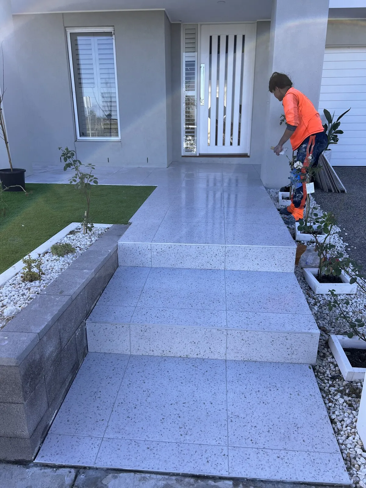 On site finishing a terrazzo look front entry and steps