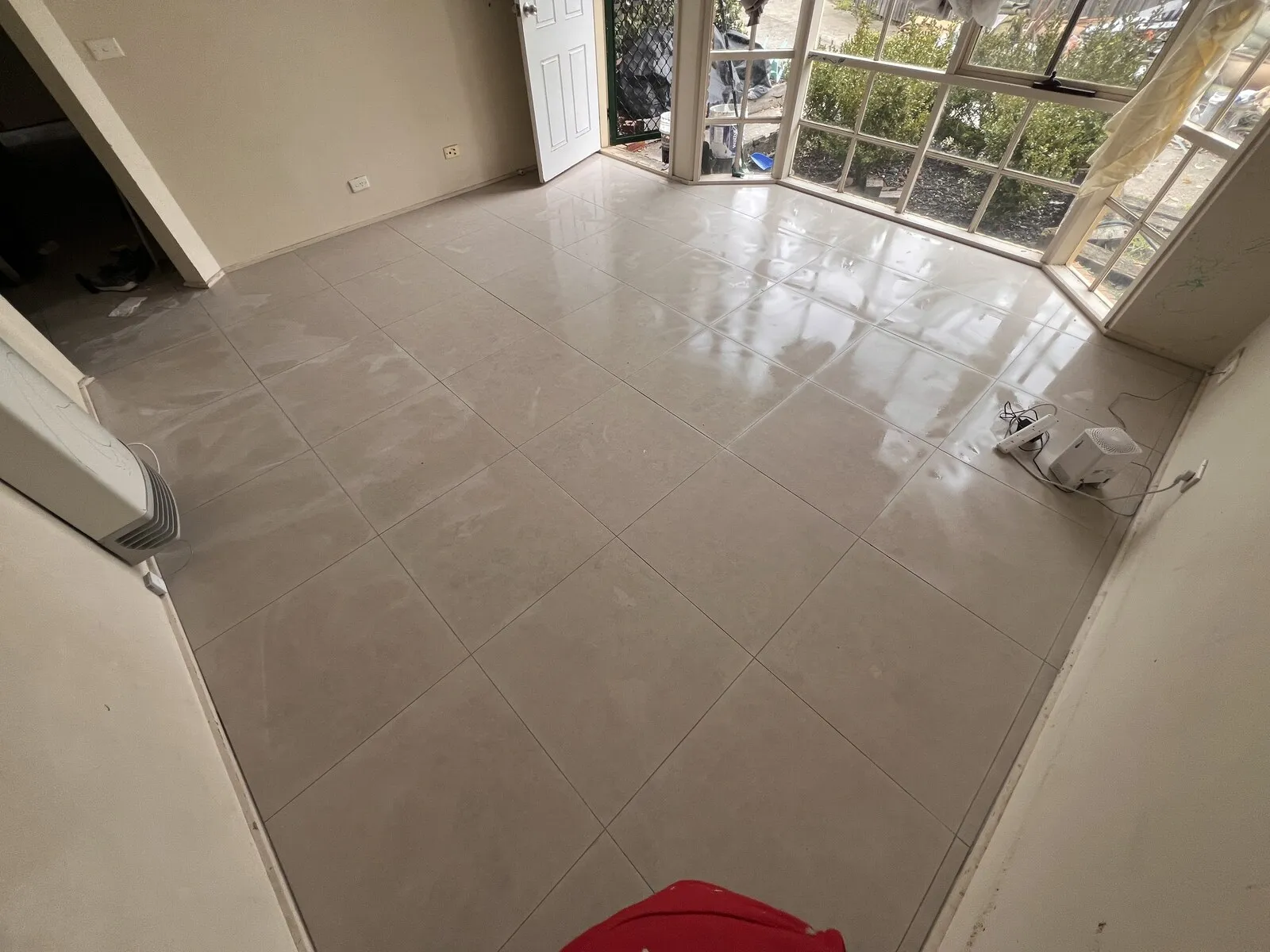 The same floor tiled by Tiles and Baths Solutions