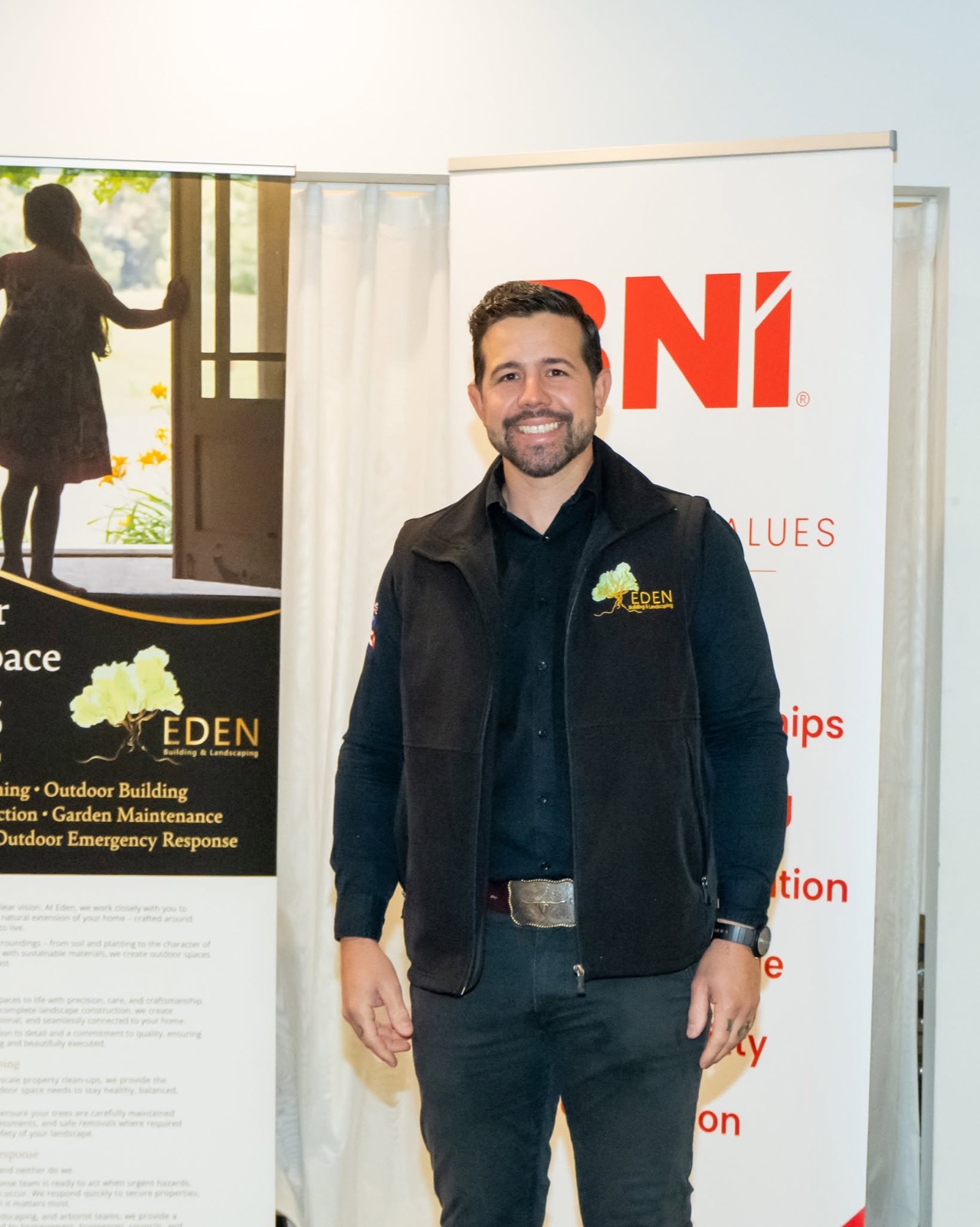 Eduardo from Eden between the Eden services banner and the BNI banner