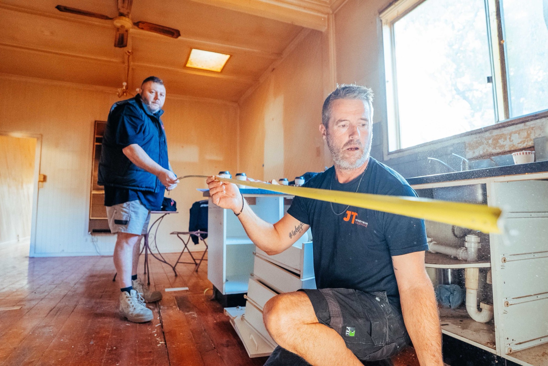 JT Handyman Solutions measuring up a job
