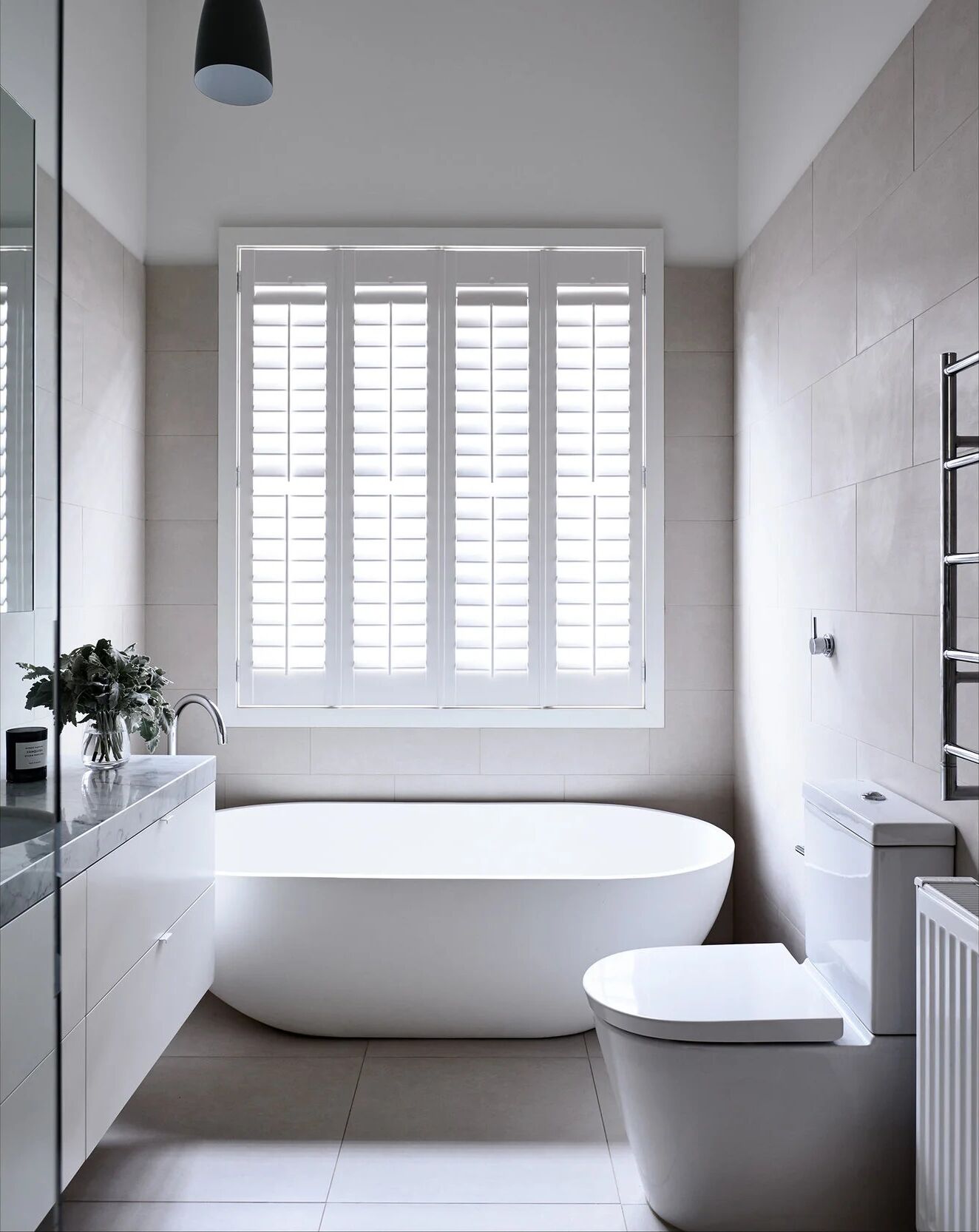 Prahran — the second bathroom, stone and tapware set out to land where the eye expects