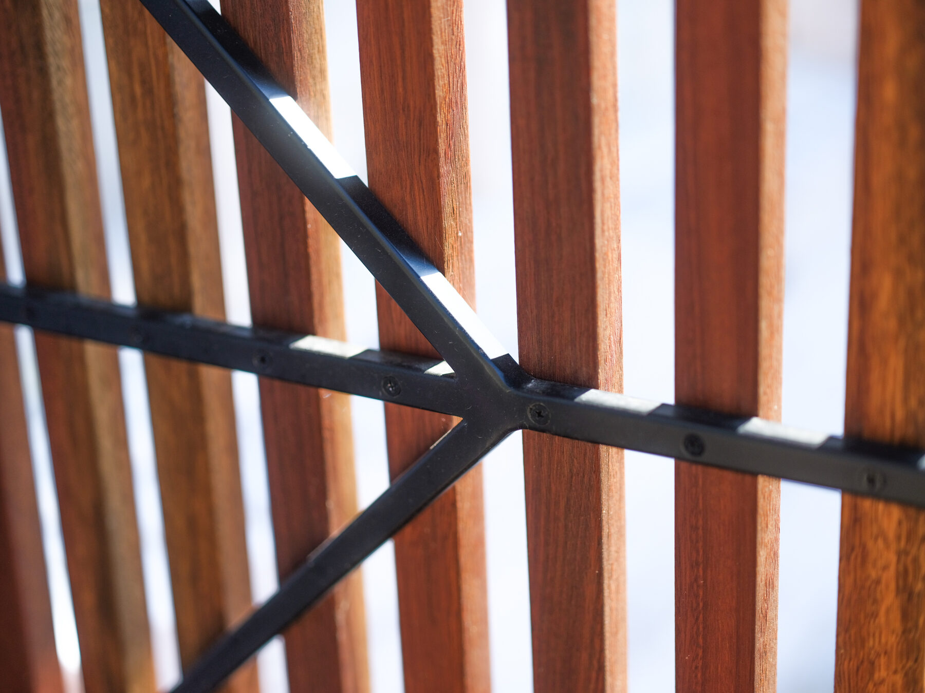 Black steel bracket detail fixing hardwood slats