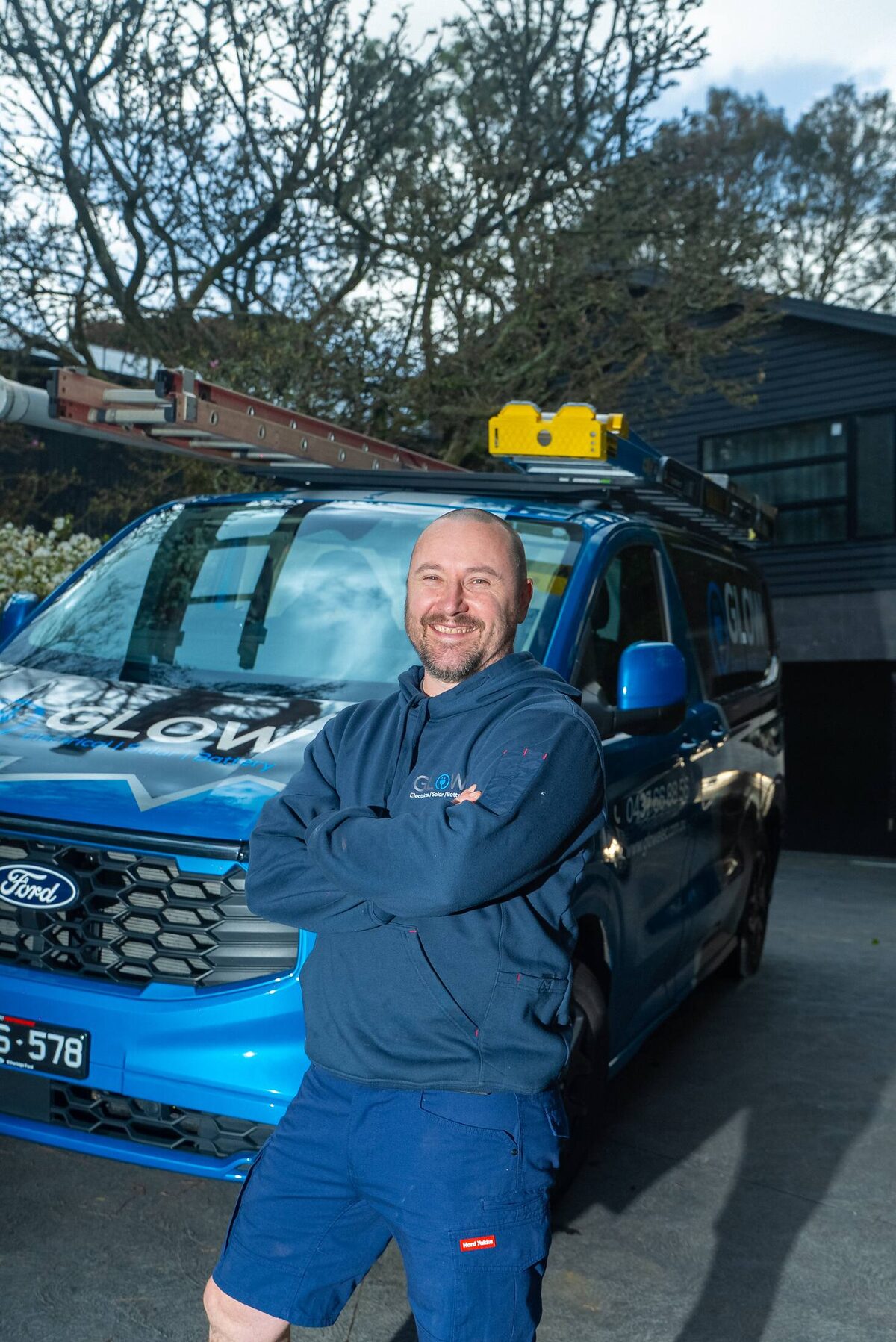 Michael from Glow Electrical beside the van in Ringwood East