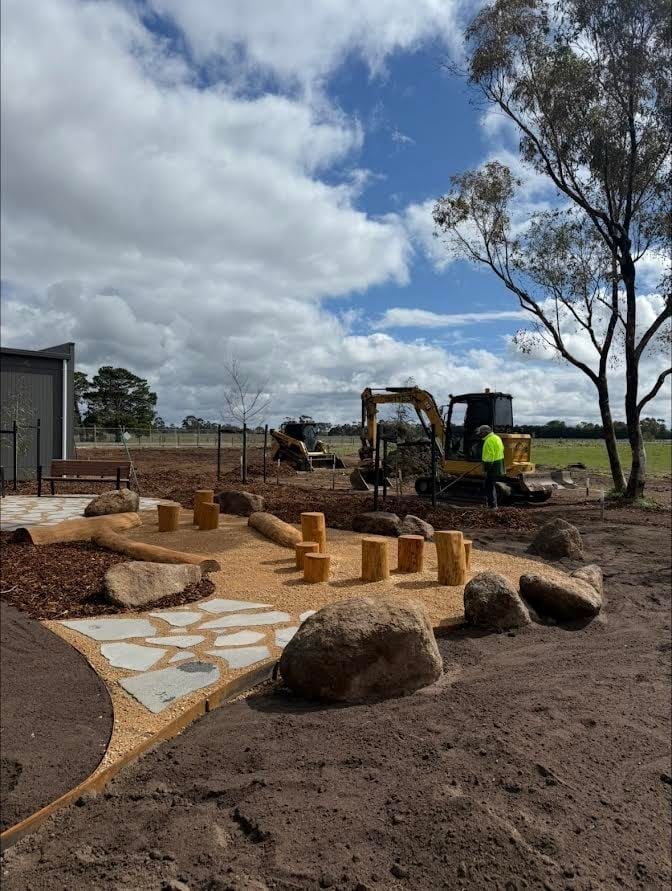 Rock placement and paving where the excavation has to end up looking like a garden.