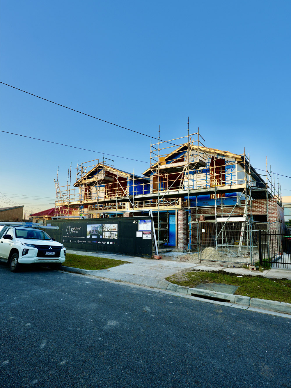 New homes under construction with a Right 1 Group vehicle on site